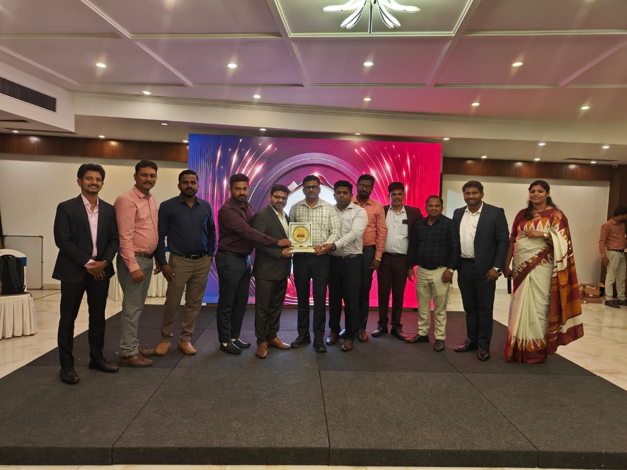 Award ceremony recognition on stage